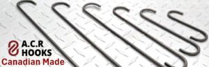 Powder coating hooks on a rack during painting